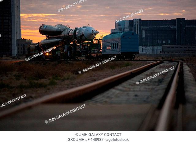 The Soyuz TMA-14M spacecraft is rolled out to the launch pad by train on Sept. 23, 2014 at the Baikonur Cosmodrome in Kazakhstan