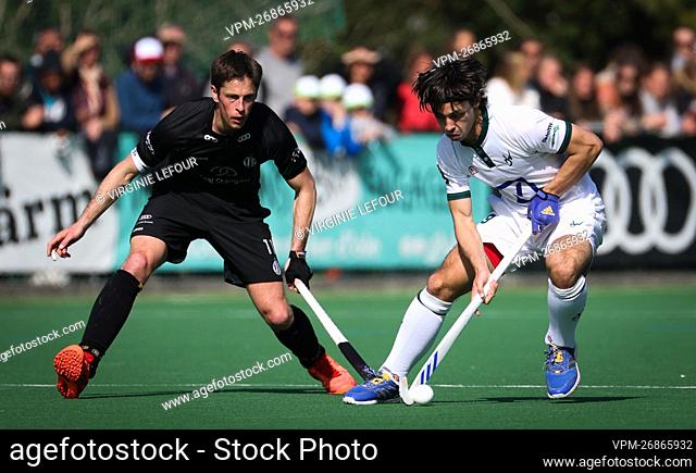 Racing's Jerome Truyens and Watduck's William Ghislain fight for the ball during a hockey game between Royal Racing Club and Waterloo Ducks H.C