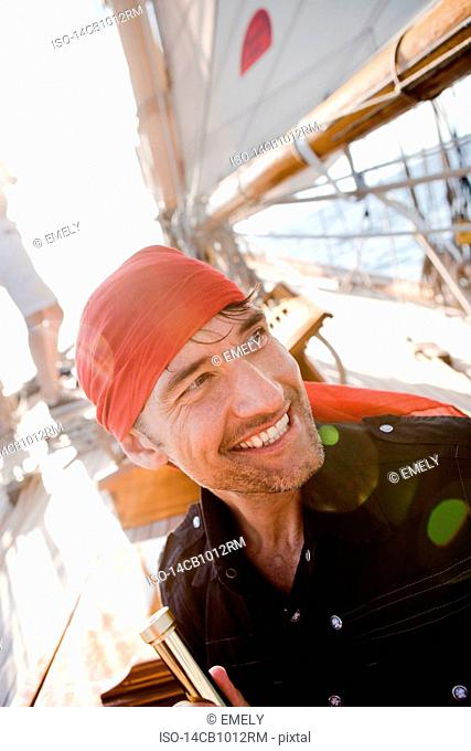 man on a sailing boat smiling