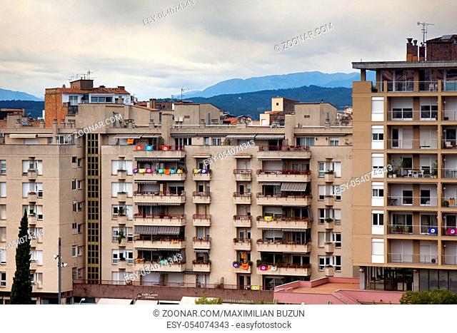 Romantic white city on hills - Spanish town Girona in foothills of Pyrenees - between peaks of Pyrenees mountains and Mediterranean sea, new city