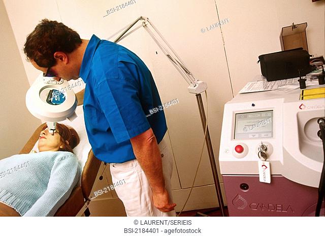 DERMATOLOGY, TREATING A WOMAN<BR>Model and doctor.<BR>Dermatologist. Lasers for treating vascular lesions. Pulsed dye can treat couperose, Port wine stains