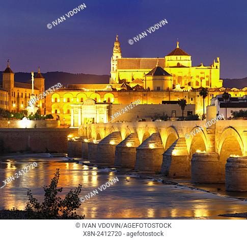 Cathedral (Mezquita) and Roman bridge at night, Guadalquivir river, Cordoba, Andalusia, Spain