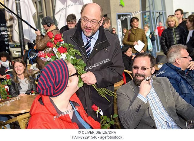 German Social Democrat (SPD) chancellor candidate Martin Schulz gives out roses to local people at the St. Johanner Market in Saarbruecken, Germany