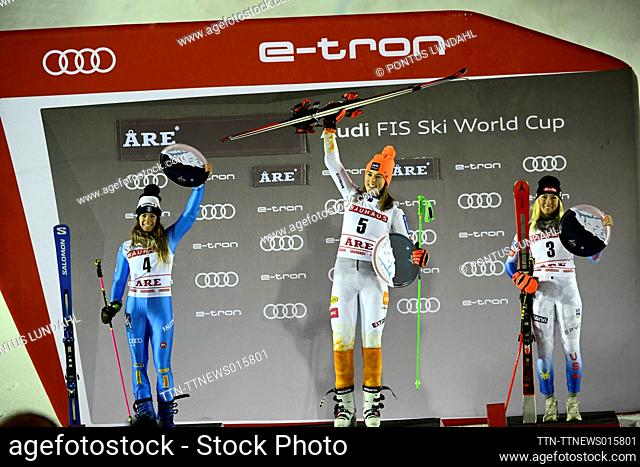 Winner Petra Vlhova (C) of Slovakia, second placed Marta Bassino (L) of Italy, and third placed Mikaela Shiffrin of USA celebrate on the podium of the women's...