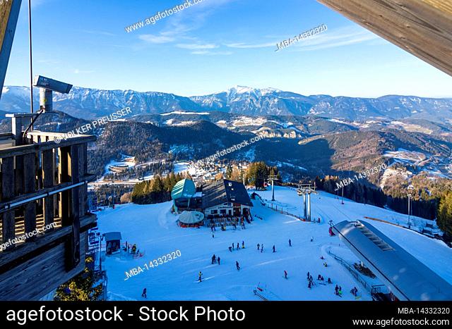 Semmering, Ski area Zauberberg Semmering - Hirschenkogel, downhill skiing, skiers, mountain station ski lift, view to mountain Schneeberg