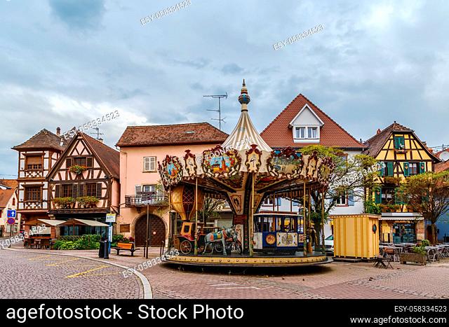 Carousel on square in Obernai city center, Alsace, France