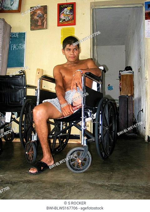 Illegal immigrant, attacked on the deathtrain, with amputated leg sitting in a wheelchair in hospice El Buen Pastor in Tapachula, Mexico, Chiapas, Tapachula