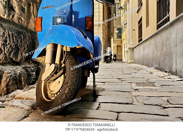 Italy, Liguria, Genoa, scooter vespa in old alleys called vicoli in historical centre