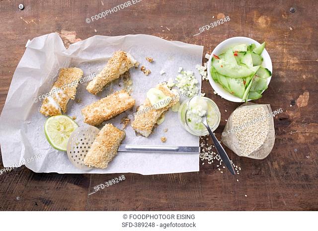 Sesame fish fingers with wasabi mayo and cucumber salad
