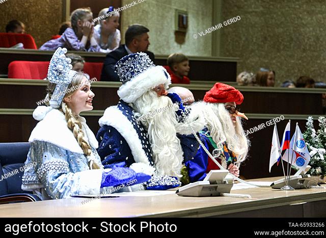 RUSSIA, MOSCOW REGION - DECEMBER 20, 2023: Snow Maiden, Father Frost of Veliky Ustyug, and Baba Yaga (L-R), Slavic fairy tale characters