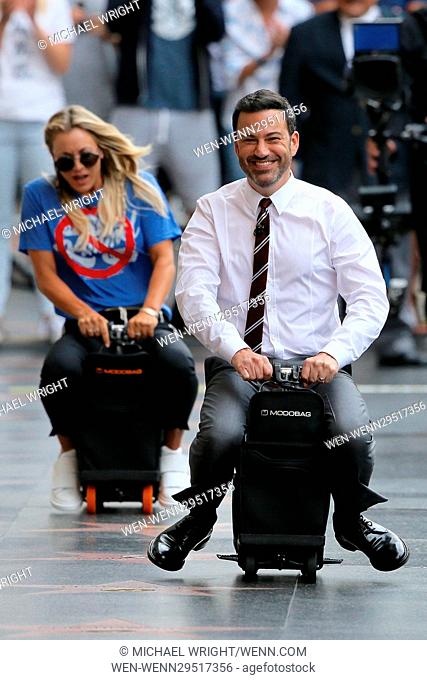 Kaley Cuoco seen on Hollywood Boulevard performing a skit where she races Jimmy Kimmel on a Modobag for Jimmy Kimmel Live