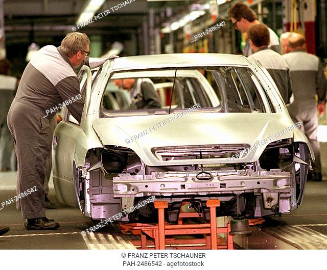 On 6.1.1998 a worker inspects the still unpainted body of a new Opel Astra caravan at the Opel plant in Bochum. Since the 5th of January