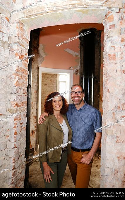 PRODUCTION - 20 July 2021, Lower Saxony, Cuxhaven: Mirabelle and Alain Caboussat stand in the water tower. The 48-metre-high water tower is one of the most...