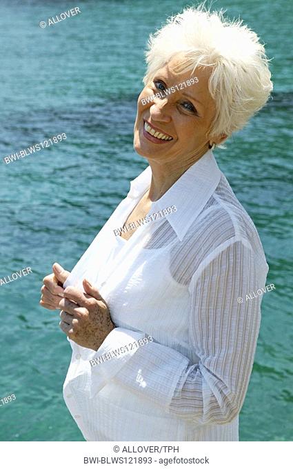 whitehaired woman at sea side