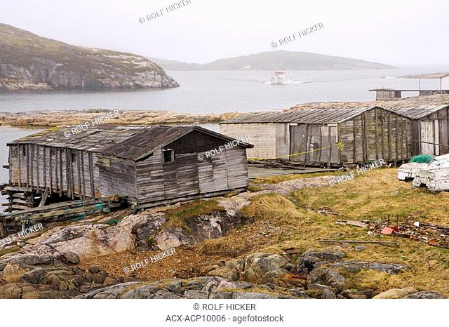 Old fishing stages along the shore at Battle Harbour, Battle Island at the entrance to the St Lewis Inlet, Viking Trail, Southern Labrador