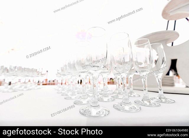 Many empty glasses in a line. the buffet in the restaurant. Banquet wedding or anniversary