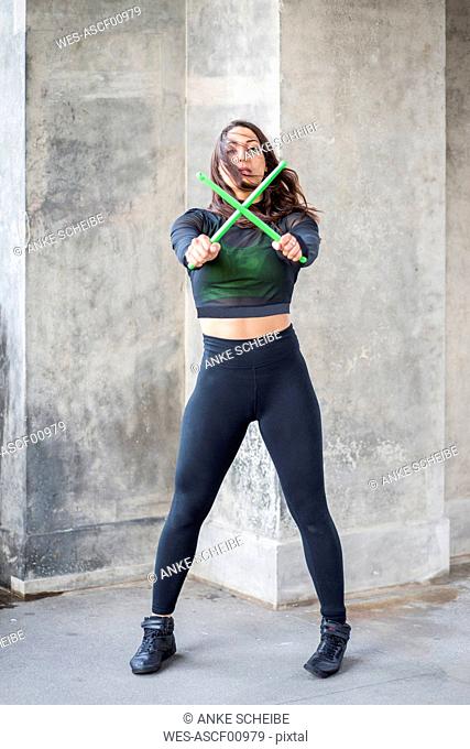 Young woman doing pound fitness exercise