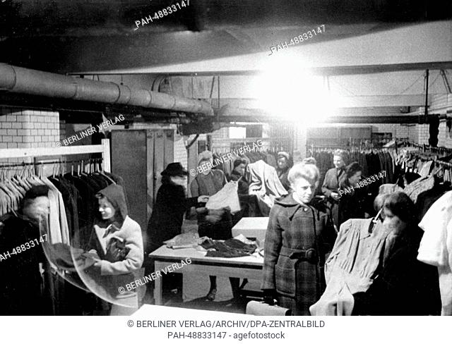 The picture from a Nazi news report shows women shopping for clothes in the basement of a boutique after an air raid in Berlin, Germany, October 1944