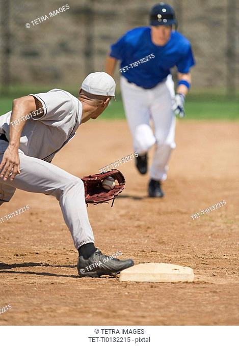 Baseball player trying to steal base