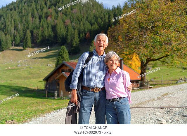 Germany, Bavaria, Senior couple on mountain hike near Wendelstein