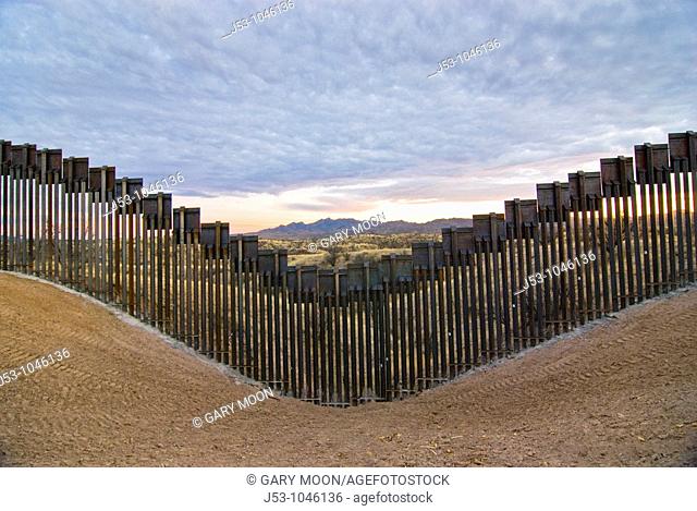 United States border fence, US/Mexico border, east of Nogales, Arizona, USA, looking south from US side of border
