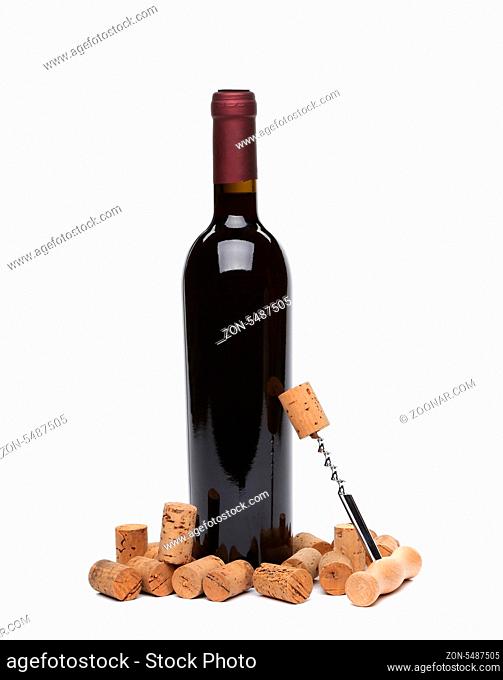 A bottle of wine, corks and corkscrew isolated on the white background
