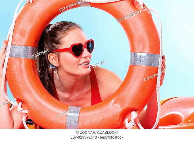 Woman in sunglasses with ring buoy lifebuoy