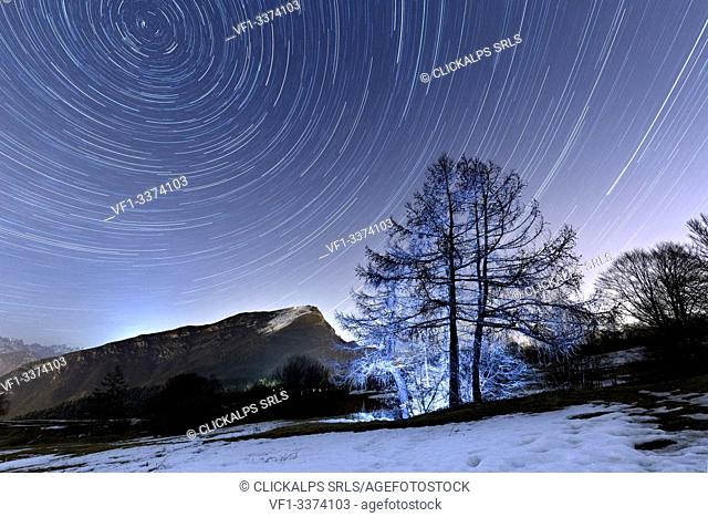 Star trails above the mounts Creino and Stivo. Gresta Valley, Trento province, Trentino Alto-Adige, Italy, Europe