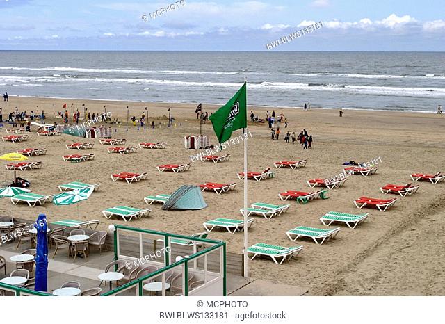 gastronomy, rows of empty canvas chairs and some tourists at the beach of Zandvoort, Netherlands