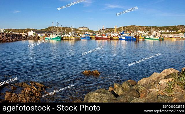 A row of colorful fishing boats in Twillingate, Newfoundland
