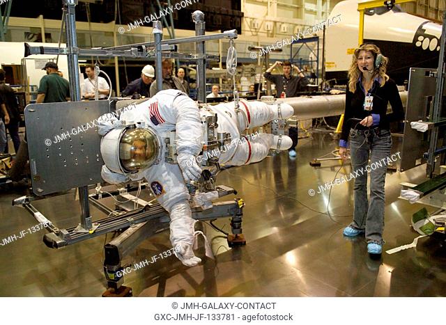 Astronaut Piers J. Sellers, STS-121 mission specialist, wearing a training version of the Extravehicular Mobility Unit (EMU) space suit