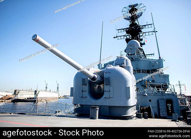 12 August 2022, Lower Saxony, Wilhelmshaven: A gun stands at the bow of the former guided missile destroyer ""Mölders"" (D186) at the Naval Museum on South...