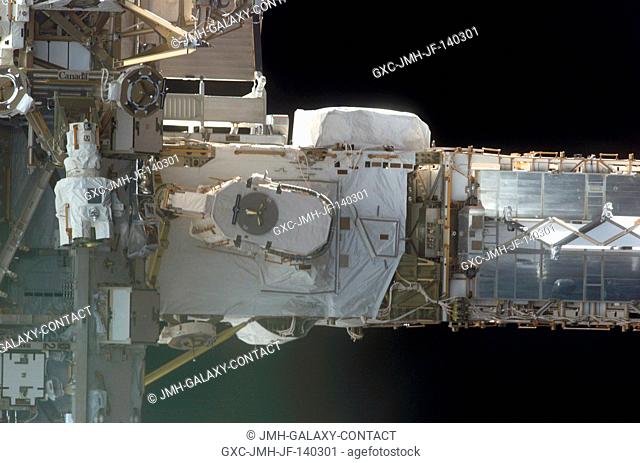 This frame and STS114-E-5283 actually can be conjoined and rotated 90 degrees to make a single frame, providing an astronaut's eye view from Discovery's aft...