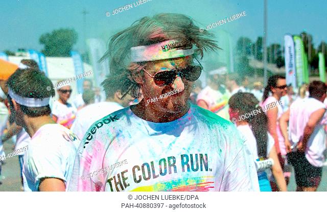 A participant in the Color Run is pictured after the race in Hanover, Germany, 07 July 2013. Several thousand participants took part in a 5 km run during which...