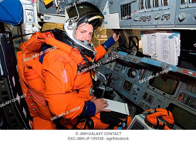 While seated at the commander's station, astronaut Mark E. Kelly, STS-124 commander, participates in a training session in the crew compartment trainer (CCT-2)...