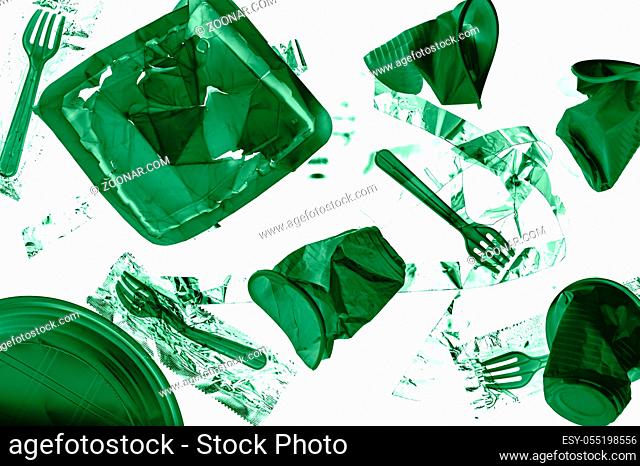Various disposable crumpled plastic trash isolated on a white background. Concept of recycling plastic and ecology. Plastic waste. Toned green