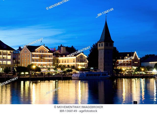 Illuminated buildings and Mangturm tower at the harbor, Lindau, Lake Constance, Bavaria, Germany, Europe