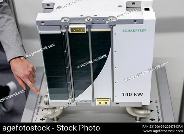 06 December 2023, Bavaria, Nuremberg: A fuel cell stack for generating electricity from hydrogen from the German manufacturer Schaeffler will be exhibited at...