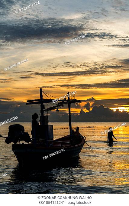 Fisherman prepare to work in dawn