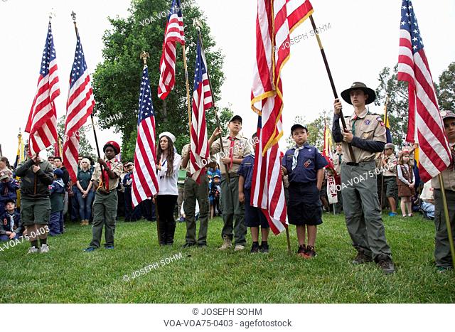 Boyscouts display US Flag at solemn 2014 Memorial Day Event, Los Angeles National Cemetery, California, USA