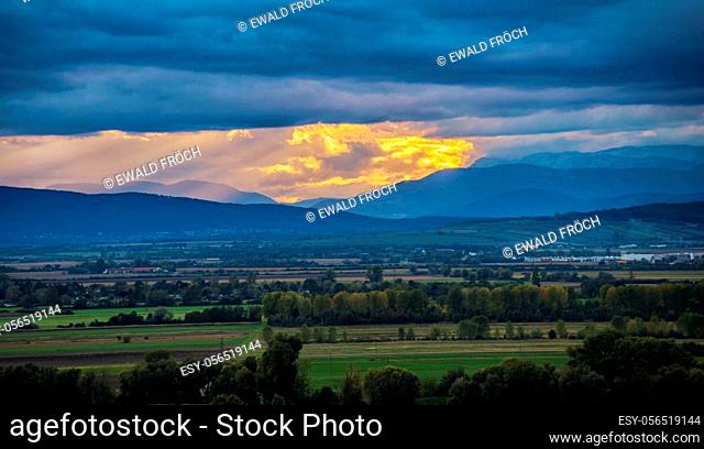 View from Burgenland to mountain ridge with dramatic sky