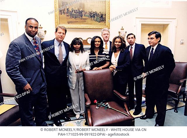 United States President Bill Clinton presents Ms. Alma Brown, wife of the late US Secretary of Commerce Ronald H. Brown, his Cabinet Room chair in a brief...