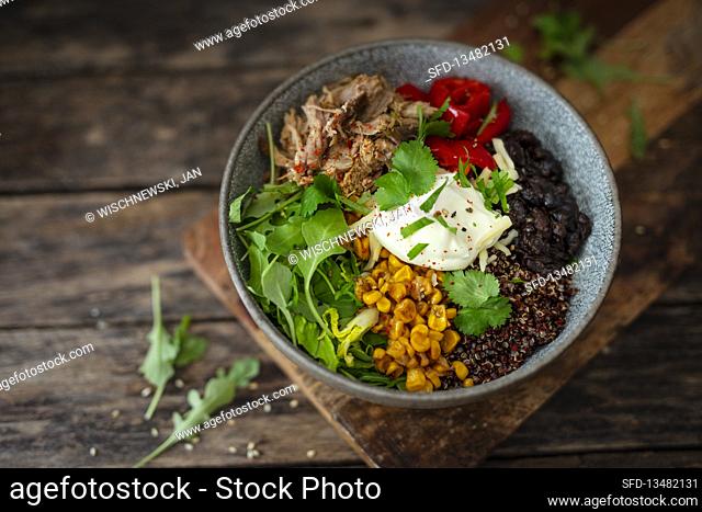 Bowl with pulled pork, black beans, corn, and quinoa