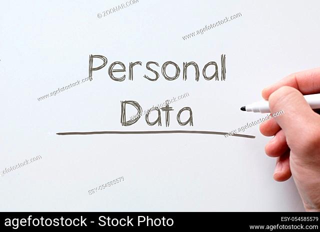 Human hand writing personal data on whiteboard