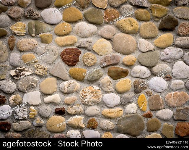 Stonewall masoned with natural rounded river stones