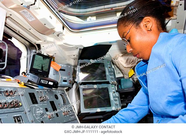 Astronaut Stephanie Wilson, STS-120 mission specialist, photographed on the aft flight deck of Space Shuttle Discovery during flight day two activities
