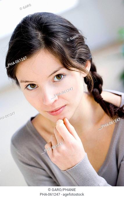 Young woman looking anguished or shy