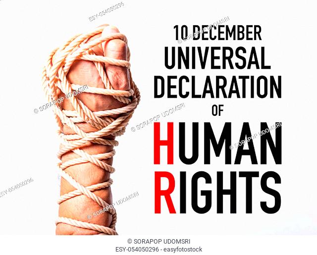 Rope on fist hand with 10 december universal declaration of HUMAN RIGHTS DAY text on white background, Human rights day concept