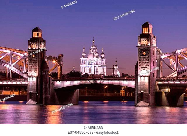 View on the Bolsheokhtinsky or Peter the Great Bridge across the Neva River and Smolny Cathedral in Saint Petersburg, Russia in the evening or night