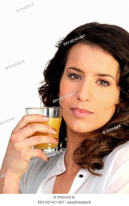 Woman drinking a glass juice